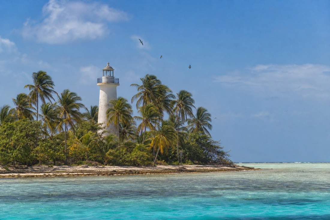 Shallow reef ring of Lighthouse Reef Atoll, Belize's outermost atoll and a base for snorkeling the Great Blue Hole Belize visitors travel for