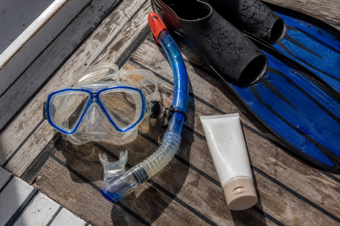 Snorkeling gear flatlay ready for a Belize Barrier Reef snorkeling day