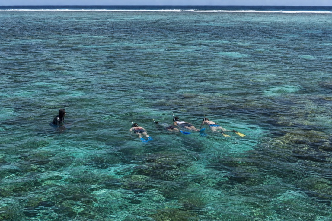 Caye Caulker snorkeling tours take snorkelers into the water over the Belize Barrier Reef near the island